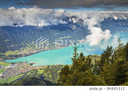 Aerial view of Swiss Alps and Lake Brienz at dramatic sunset, Interlaken Aerial view of Swiss Alps and Lake Brienz at dramatic sunset, Interlaken 96895312