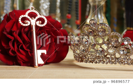 Red Rose with Key and Tiara on Dressing Table With Shallow DOF Red Rose with Key and Tiara on Dressing Table With Shallow DOF 96896577