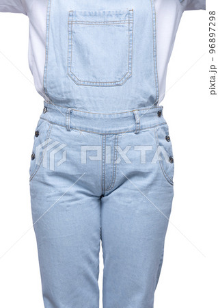 Woman in a jeans jumpsuit 96897298