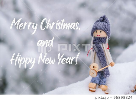 Merry Christmas and Hippy New Year Inspiration joke quote phrase Angel gnome in scarf and knitted hat skiing on snowy fir branch Elf toy on skis in snowy landscape New year and Merry Christmas 96898824