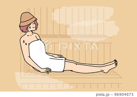 Woman in body towel sits, sweating on bench in sauna. 96904873