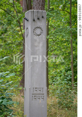 The vertical view of a concrete pillar in the burial of the victims of Nazi terror The vertical view of a concrete pillar in the burial of the victims of Nazi terror 96910807