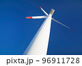 Wind turbine over blue sky 96911728