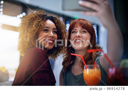 Phone, selfie and friends with club cocktail for happy hour, wellness and bonding. Interracial, women and friendship gathering with smartphone photograph and alcohol drinks with smile. 96914278