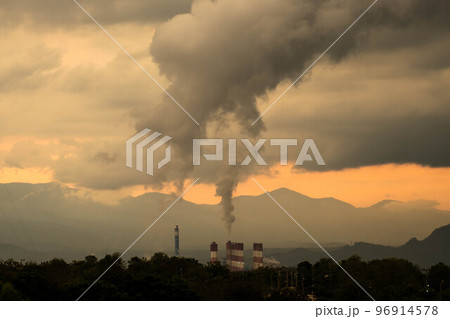 Time lapse of a coal power plant and steam pouring out of stacks at sunset. Aerial view of coal power plant at night. Industrial landscape Time lapse of a coal power plant and steam pouring out of stacks at sunset. Aerial view of coal power plant at night. Industrial landscape 96914578
