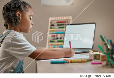 Girl writing, education toys and laptop in house with crayons, paper and mental development by desk. Young african child, female learner or pen for notes, drawing or learning in home school with pc 96915386