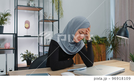 Muslim business woman use smartphone surprised sudden lottery results, bad news, fortune loss, fail 96918109