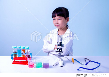 Kid scientists studying science, experimenting with chemicals or microscope, Young scientist making experiments in home laboratory, Child and science, children making science experiments, Education. 96922637