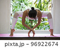 Young Asian woman doing yoga exercise at home. 96922674