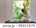 Young Asian woman doing yoga exercise at home. 96922676