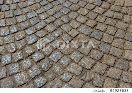 Cobblestone road. Gray cobblestone texture, vintage road surface Cobblestone road. Gray cobblestone texture, vintage road surface 96923683