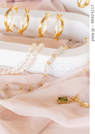 Girl jewelry accessories including earrings and necklaces on display 96924217