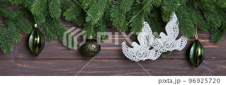Concept of Christmas Wish for Peace. Xmas background with fir branches, decorations and decorative doves. Concept of Christmas Wish for Peace. Xmas background with fir branches, decorations and decorative doves. 96925720