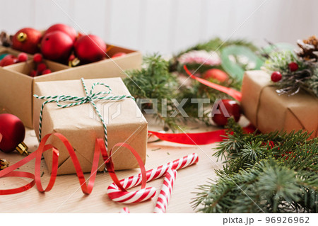Gifts in craft paper with ribbons and bows for new year or Christmas. Preparation for the holiday Gifts in craft paper with ribbons and bows for new year or Christmas. Preparation for the holiday 96926962