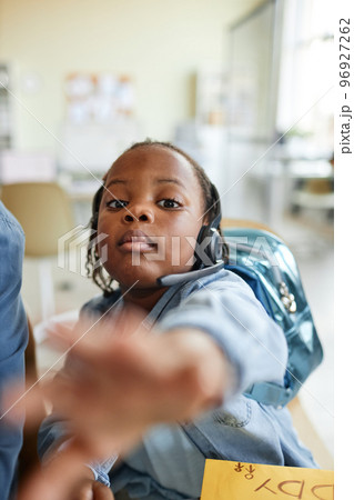 Child reaching to camera 96927262