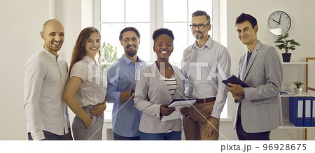 Team of happy smiling successful multiracial business people standing in the office 96928675