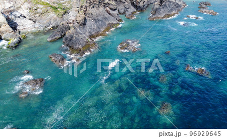 Steep cliffs on the coast of Ireland. Turquoise waters of the Atlantic Ocean. Natural beauties of Ireland, West Cork. The rocky coast of the Celtic Sea. 96929645