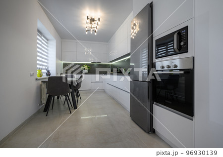 White modern kitchen with granite counter top and marble floor White modern kitchen with granite counter top and marble floor 96930139