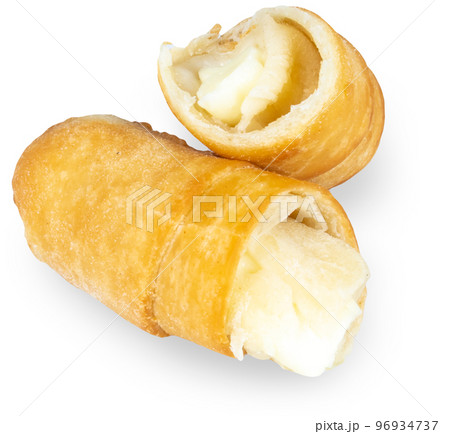 Tequenos cut in halves, Venezuela appetizer from dough with melted cheese inside. Tequenos cut in halves, Venezuela appetizer from dough with melted cheese inside. 96934737