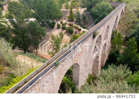 View from drone of medieval arched aqueduct in Sant Pere de Riudebitlles 96941752