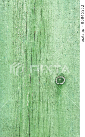 Natural weathered wooden planks background. Old painted in green boards panels Natural weathered wooden planks background. Old painted in green boards panels 96945552