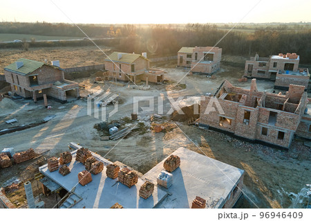 Industrial building site in rural area with residential houses under construction for future sale or leasing. Concept of real estate development 96946409