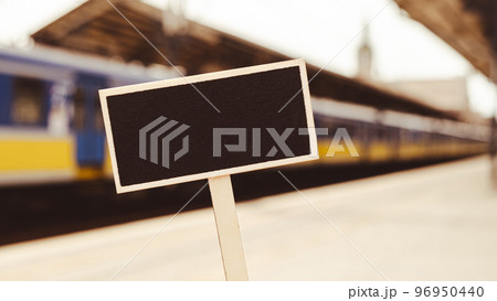 Empty mockup template Blackboard label against defocused background railway station with locomotive. Advertisement Eco Transportation Concept Eco-friendly modes of transport Copy space for text Empty mockup template Blackboard label against defocused background railway station with locomotive. Advertisement Eco Transportation Concept Eco-friendly modes of transport Copy space for text 96950440