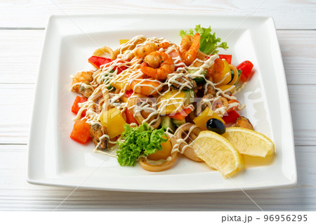 Mayonnaise seafood salad served on white plate 96956295