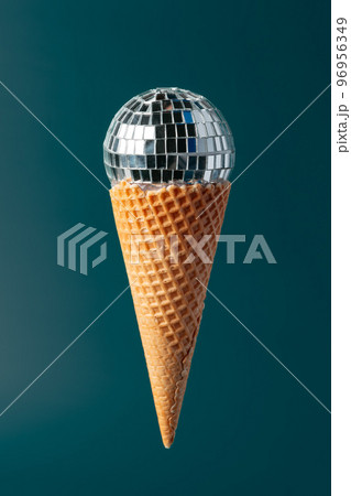 Christmas fun decorative fake ice cream cone on dark green background 96956349