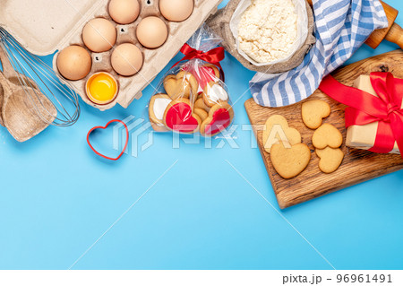 Cooking gingerbread heart cookies for Valentines day Cooking gingerbread heart cookies for Valentines day 96961491
