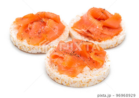 Rice Cake Sandwiches with Fresh Salmon Slices Isolated on White Rice Cake Sandwiches with Fresh Salmon Slices Isolated on White 96968929