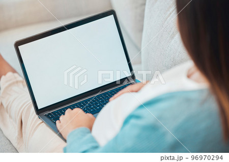 Woman, laptop screen and home sofa for online shopping, internet search and communication on social media reading ecommerce ads. Free mockup space for product placement or website with pregnant woman 96970294