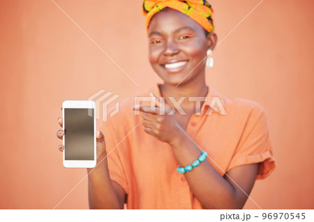 Mockup, black woman and blank smartphone screen for marketing, advertising and against brown studio background. Female, Jamaican lady and phone for social media, search internet and online website. 96970545