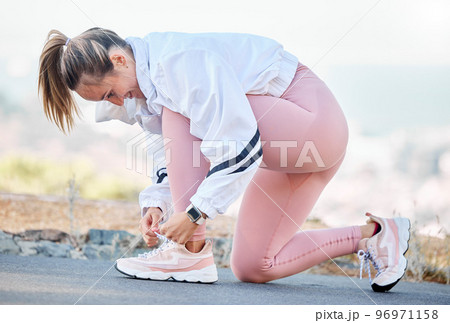 Fitness, running and tie shoes with woman mountain path ready for workout, jogging and endurance. Start, exercise and stamina with girl runner training in nature trail for hiking, cardio and sports 96971158