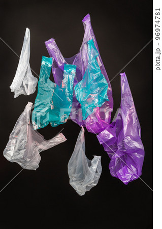 Vertical shot collection of colorful plastic bags. Isolated on black background. Vertical shot collection of colorful plastic bags. Isolated on black background. 96974781