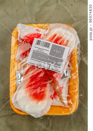 Used womens pads wrapped in plastic container. Waste sorting concept. Vertical shot top view. Used womens pads wrapped in plastic container. Waste sorting concept. Vertical shot top view. 96974830