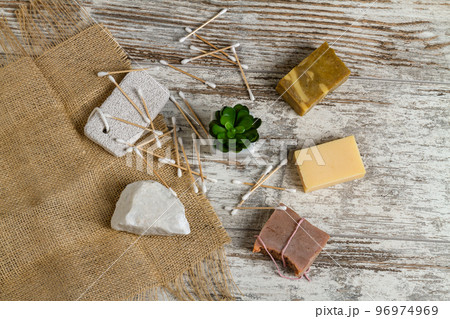 Top view bath and spa accesspries and houseplant. Craft soaps and salt rock. Bamboo ear sticks. Top view bath and spa accesspries and houseplant. Craft soaps and salt rock. Bamboo ear sticks. 96974969