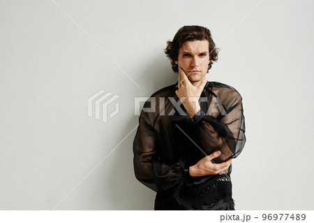 Feminine young man wearing makeup Feminine young man wearing makeup 96977489