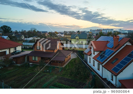 Aerial view building roof with rows of blue solar photovoltaic panels for producing clean ecological electric energy. Renewable electricity with zero emission concept 96980864