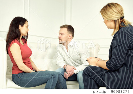 Unhappy couple sharing emotions with psychologist Unhappy couple sharing emotions with psychologist 96983272