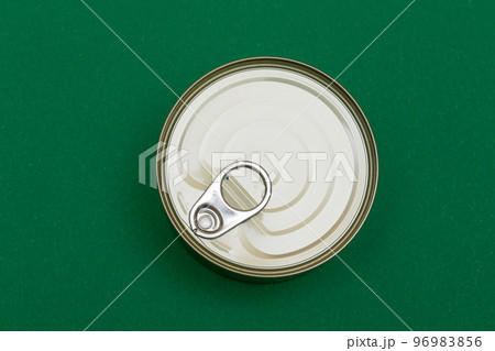 Unopened Tin Can with Blank Edge on Green Background Unopened Tin Can with Blank Edge on Green Background 96983856