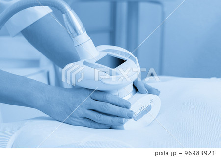 Close up view of anti cellulite massage in a spa salon. LPG, and body contouring treatment in clinic. 96983921