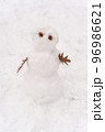 Funny snowman standing in the winter forest 96986621