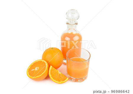 Orange juice in glass and bottle isolated on white background. Orange juice in glass and bottle isolated on white background. 96986642