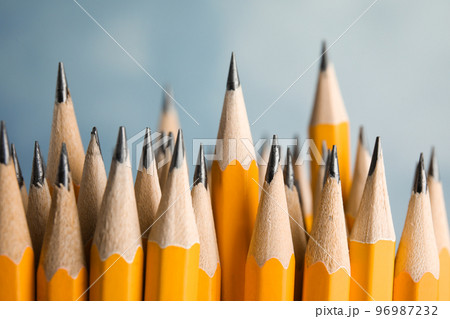 Many graphite pencils on blue background, closeup 96987232