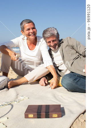 Happy senior couple enjoying dominoes game 96991120