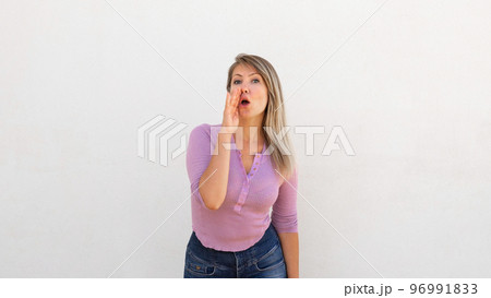 Serious Caucasian woman telling rumors Serious Caucasian woman telling rumors 96991833