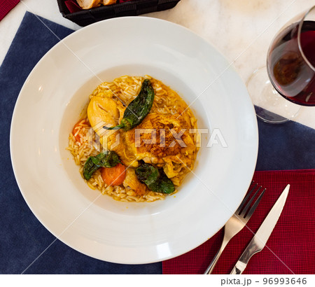 Traditional french cuisine, сhicken thigh curry with rice 96993646