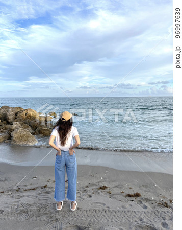 Young beautiful woman relax on the beach Young beautiful woman relax on the beach 96997639