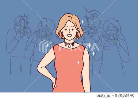 Smiling woman in dress posing for photographers and paparazzi during fashion show. Vector image 97003440